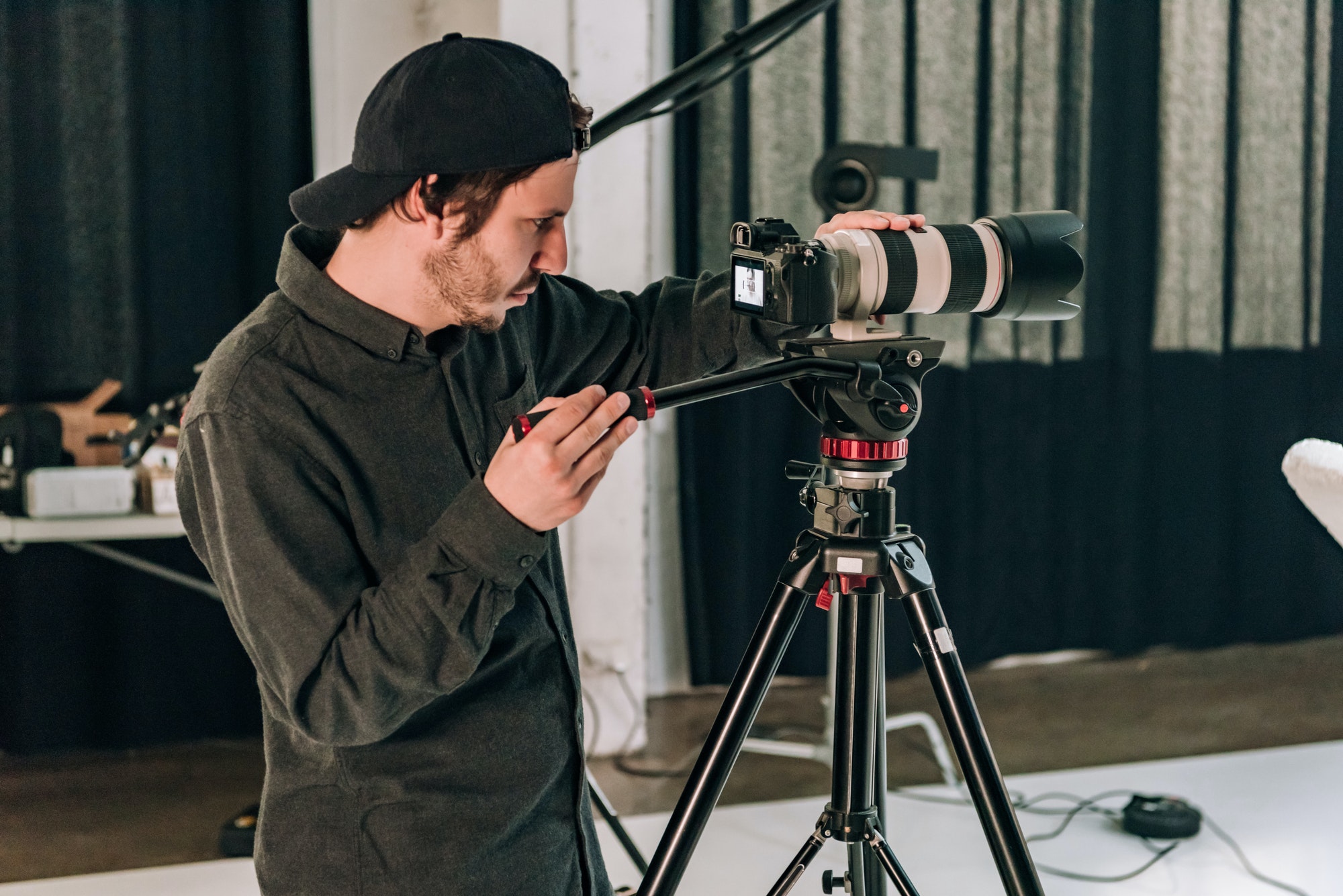 side-view-of-cameraman-working-in-photo-studio.jpg